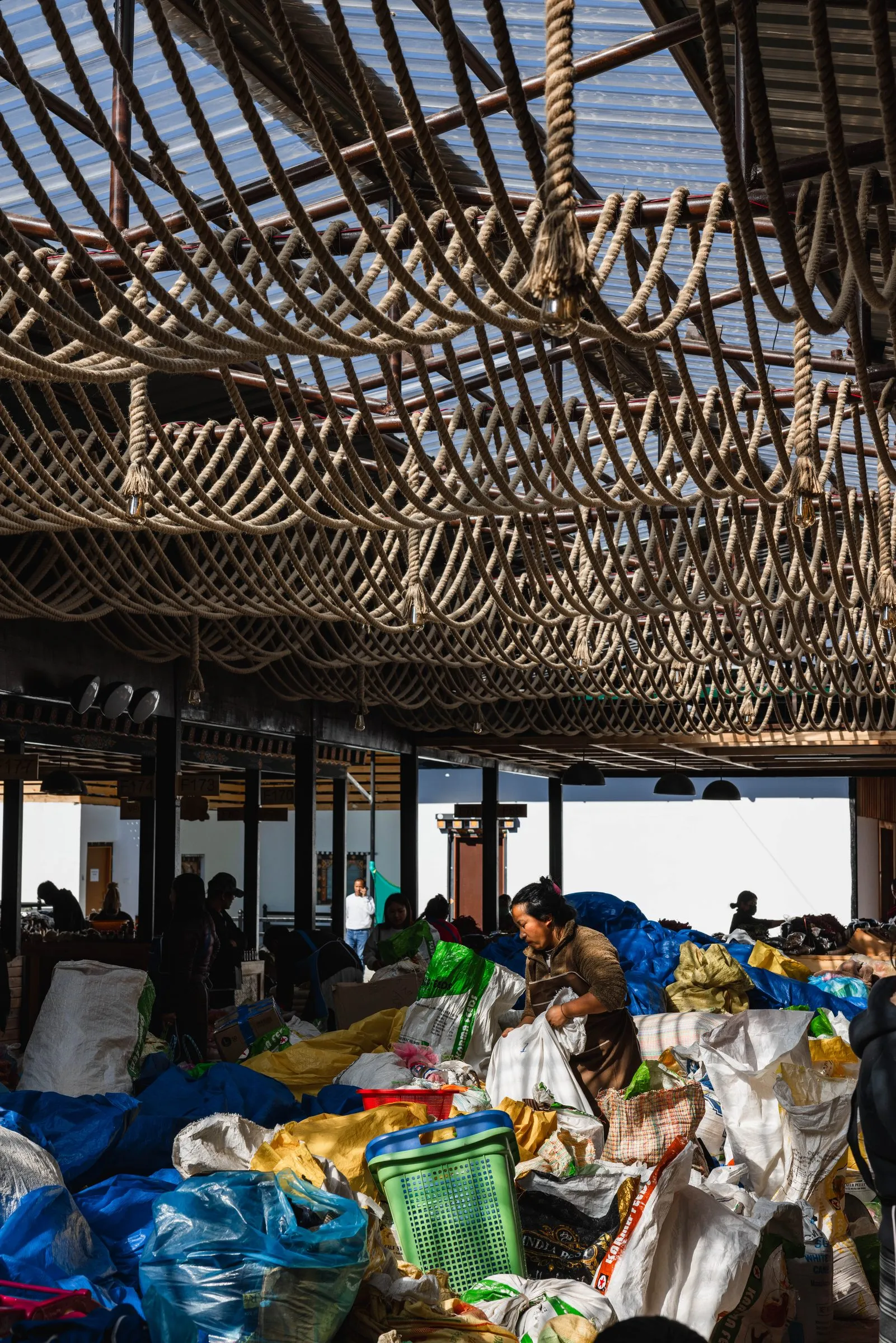 A covered market hall under a timber-beamed roof